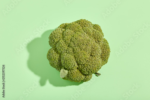 Top view of fresh green broccoli with hard shadow