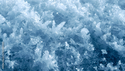 Frozen Blue Ice Texture with Crystalline Frost Patterns, Translucent Surface and Cool Winter Abstract Background