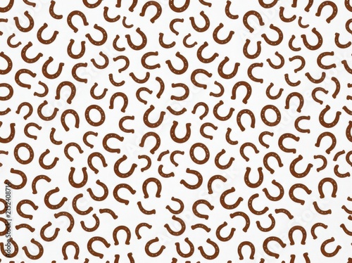 Seamless pattern with brown horseshoes on white background