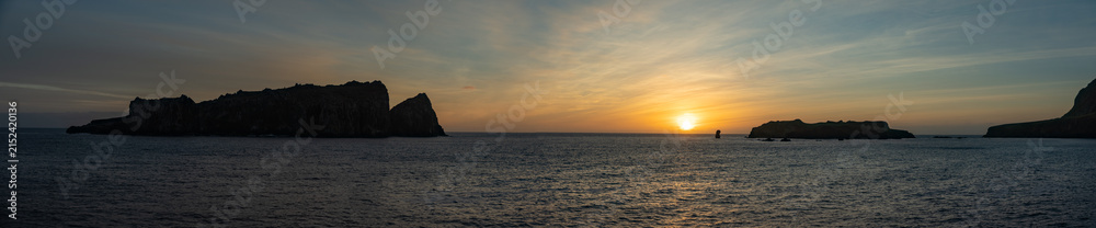 Fototapeta premium Panorama of Nightingale Island in silhouette at sunrise, in the South Atlantic Ocean