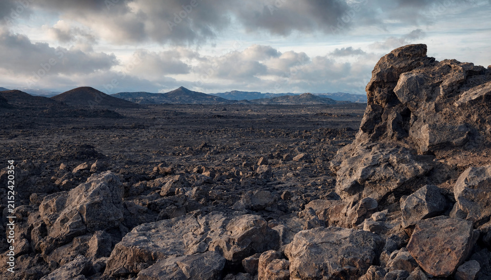 Fototapeta premium Rugged volcanic rock formation in foreground overlooking vast desolate lava field and distant mountains with landscape mountain volcanic formation wilderness desolate outdoors hardened