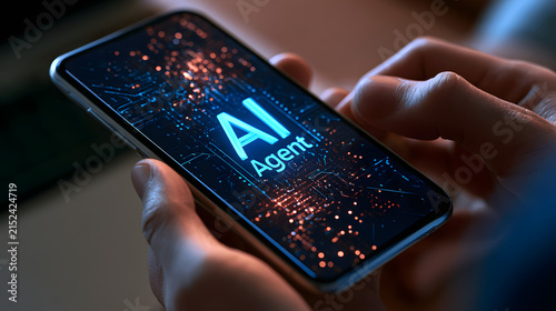 AI Agent text on a smartphone screen. Person holding a mobile phone with an artificial intelligence agent
