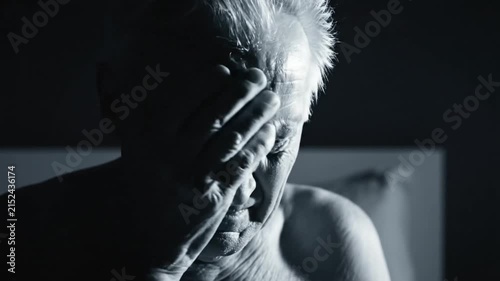 Distressed Senior Man Close-Up In Dramatic Black And White