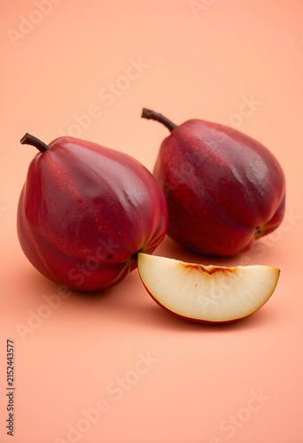 Two fresh red nectarines an...
