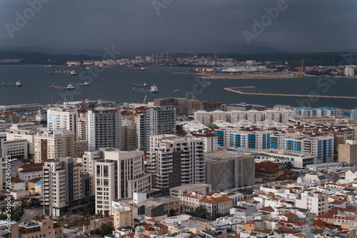 Panoramic high angle view of the Bay of Gibraltar, harbor, and cityscape from the Rock of Gibraltar