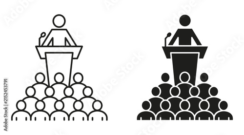 Фотография Speaker Addressing Audience: A speaker stands behind a podium, addressing an attentive audience