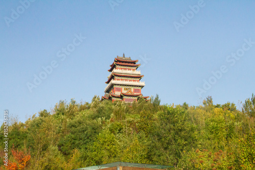Siping, Jilin, China - September 10, 2023: The 7-tier traditional Chinese Nalan Tower rising above trees and autumn foliage. The pavilion was built to honor the famous Qing Dynasty poet Nalan Xingde.