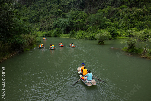 Boating in Ninh Binh (Vietnam) along the winding emerald river