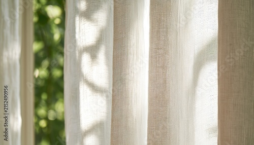 Soft, sheer fabric drapes with sunlight filtering through, creating dappled patterns