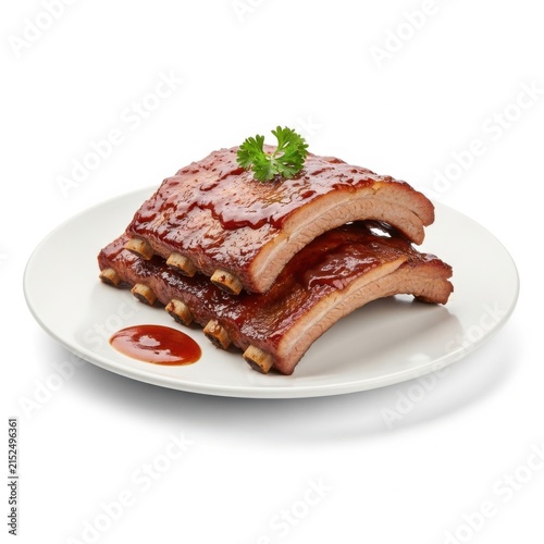 Delicious grilled pork baby back ribs glazed with savory barbecue sauce on a white ceramic plate