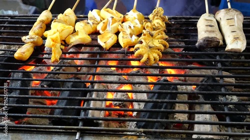 Slow motion grilling squid, Asian Street Food