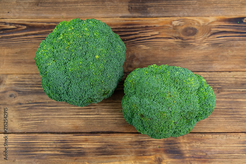 Green broccoli cabbage on a wooden background. Healthy eating. Top view