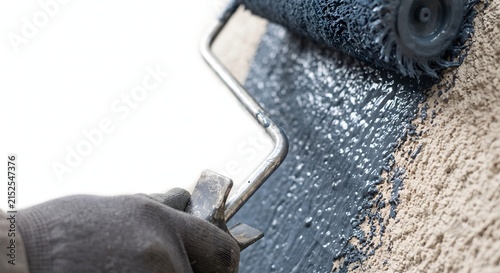 Roller Applying Blue Gray Paint On Textured Decorative Plaster Wall. Macro Material Depth Shot, Architectural Coating With White Copy Space.