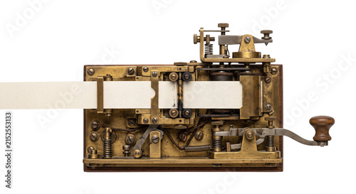 Bild auf Leinwand Antique brass telegraph machine with paper tape and wooden handle