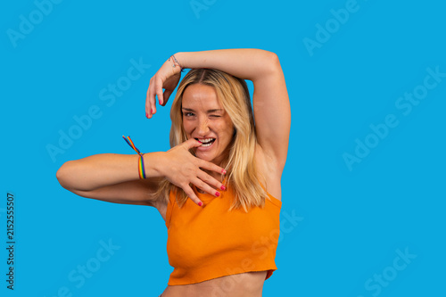 Obraz na plátně Woman winking wearing rainbow pride bracelet