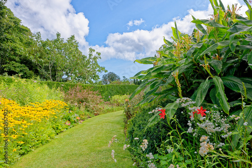Vibrant Mixed Flower Herbaceous Border Along Curved Grass Path