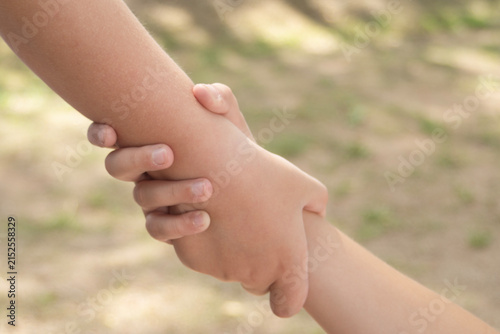 Children support each other and lend each other a helping hand.