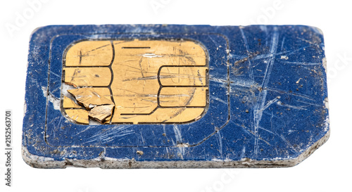 Bild auf Leinwand Close-up of a damaged and dirty blue SIM card with scratched gold contacts