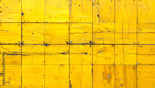 Weathered yellow wooden boards architectural background