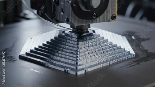 Precision 3D Printing Close-up of Nozzle Extruding Hexagonal Structure ideal for additive manufacturing and engineering concepts.