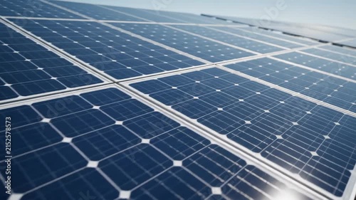Sustainable Energy Close-up of Blue Solar Panels Reflecting Sunlight under Clear Sky ideal for renewable energy projects.
