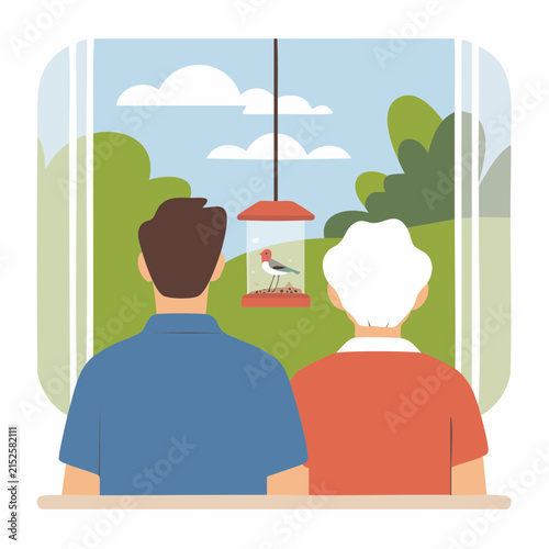 A man and an elderly woman gaze out a window, watching a bird feeder in a vibrant garden, enjoying a moment of shared tranquility and connection with nature.