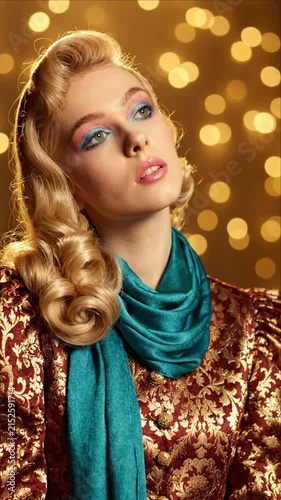 Elegant woman in vintage outfit posing with bokeh background
