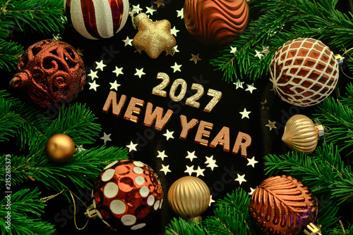 New Year 2027 dark background. Number of the coming year in Christmas decoration.