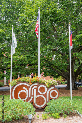 Photo of the Carrboro city sign in front of the Carrboro Town Hall in Carrboro, NC