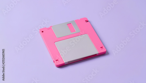 Symmetrical High-Angle View of Pink Retro Floppy Disk on Soft Lilac Background
