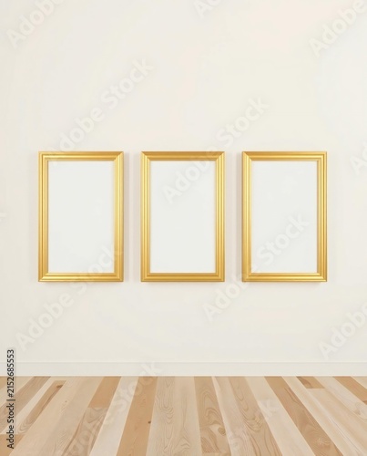 Three golden frames on white wall
