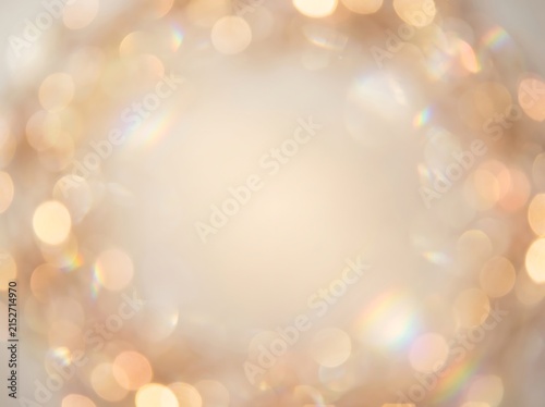 Warm gold bokeh lights blurred circle background with background defocused celebration backdrop abstract