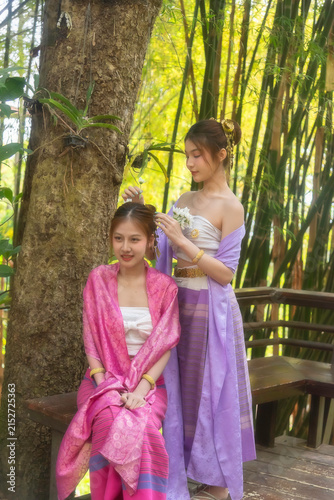 Traveler and woman tourist enjoy walking to see the historic park of Thailand exciting to explore the wonderful place of sightseeing.