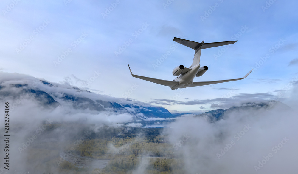Naklejka premium Private Business Jet Flying Over Misty Mountains and Clouds Above BC Canada — 3D Rendering