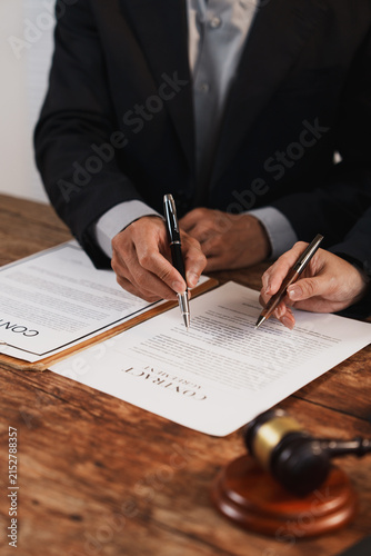Business partners signing a legal contract agreement