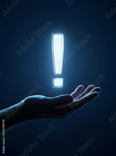 A glowing exclamation mark floating above a human hand in the dark