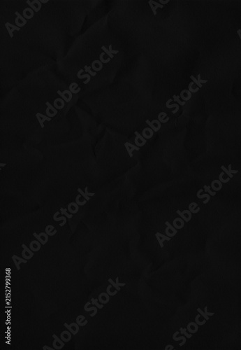 Fotografía Solid black crumpled paper texture with soft undulations and subtle creases, providing a seamless, sophisticated background for minimalist designs or artistic visuals