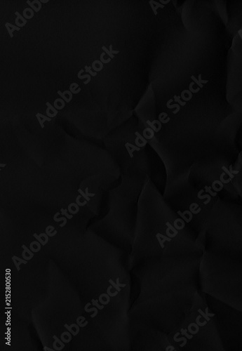 фотографія Dark charcoal wrinkled paper surface features subtle highlights and deep organic folds suitable for minimal aesthetic design projects and sophisticated high contrast background art
