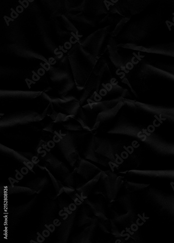 Fotografie Dramatic noir paper texture with heavy crushing and complex angular folds offers a bold tactile surface for experimental digital art and gritty underground music album cover designs