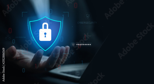 Cybersecurity concept featuring a digital shield and padlock above a laptop, representing data protection, online privacy, network security, encryption, and secure digital business.