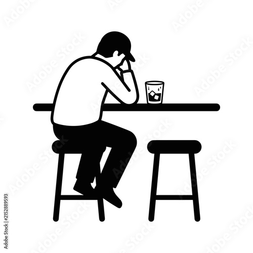 Man sitting alone at bar with drink.