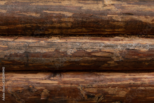 Photography Wooden logs stacked in a row for construction