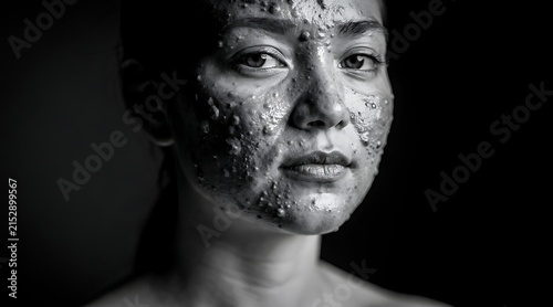 High Contrast Black and White Portrait of Woman with Facial Mask