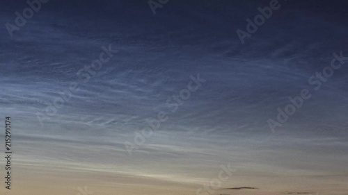 Rare noctilucent clouds illuminating the night sky