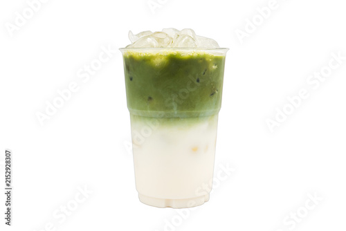 Iced milk matcha green tea layered in a plastic cup, isolated white background.