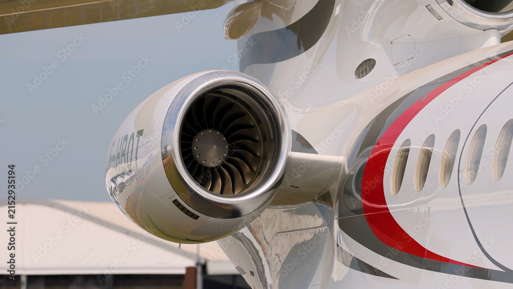 Obraz premium Close-Up of a Modern Business Jet Engine and Fuselage