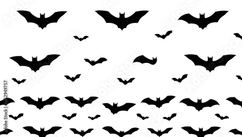 Many black bats flying in a flock