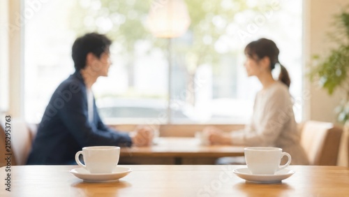 Fototapeta カフェで向かい合って会話する男女のお見合いと婚活イメージ