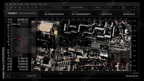 Digital target tracking interface displays an aerial satellite view of an urban area with coordinates and tracking data.