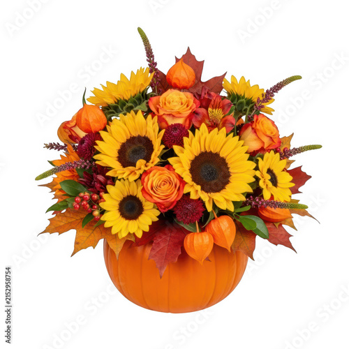 Colorful sunflowers in a pumpkin vase arrangement